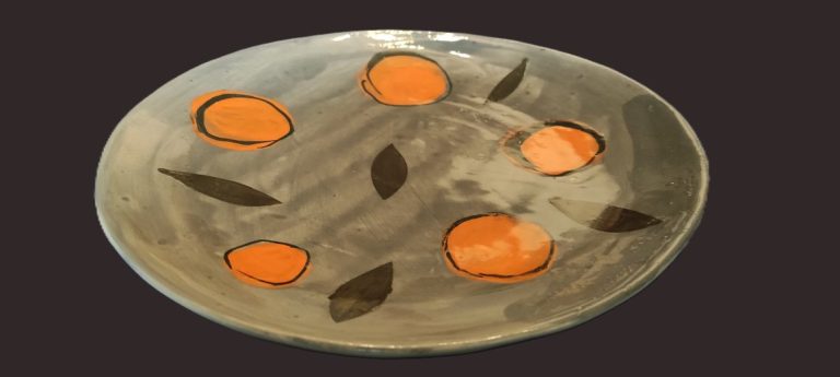 Assiette décor orange